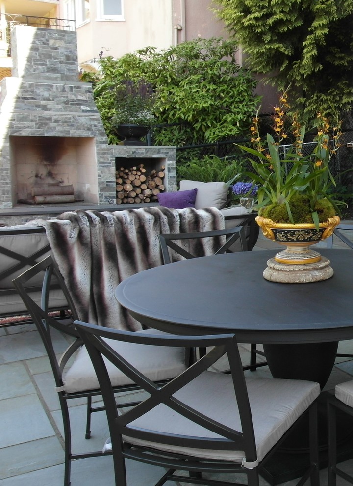 Inspiration for an eclectic patio remodel in Portland with a fire pit