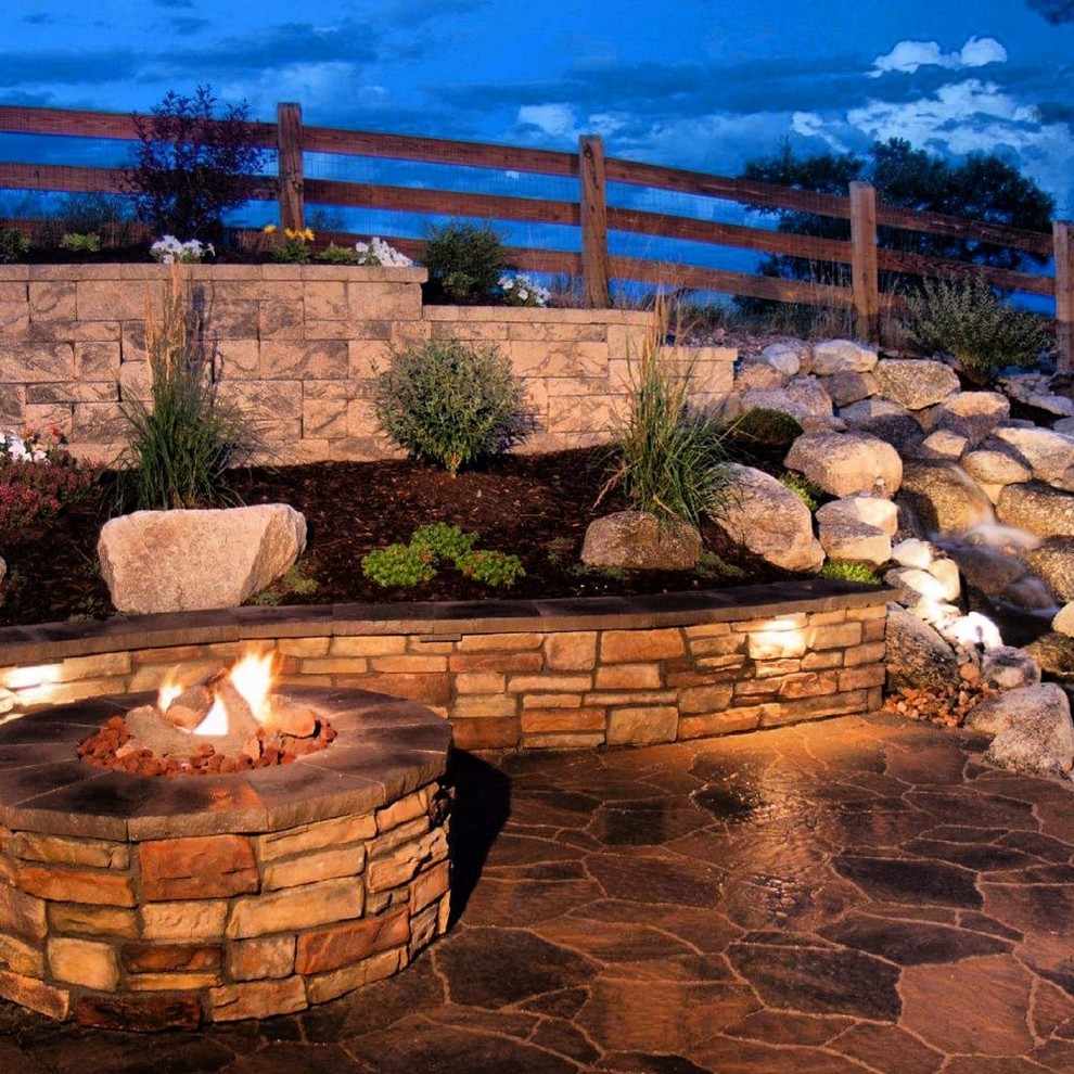 Inspiration for a medium sized classic back patio in San Francisco with a fire feature, natural stone paving and no cover.