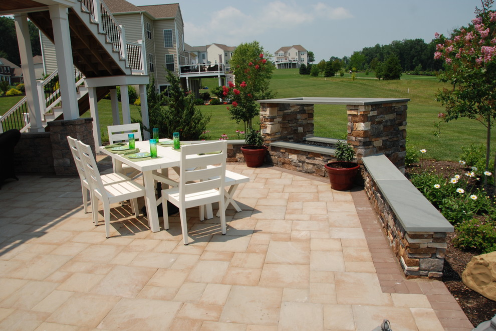 Inspiration for a small timeless backyard concrete paver patio remodel in Philadelphia with a fire pit and a pergola