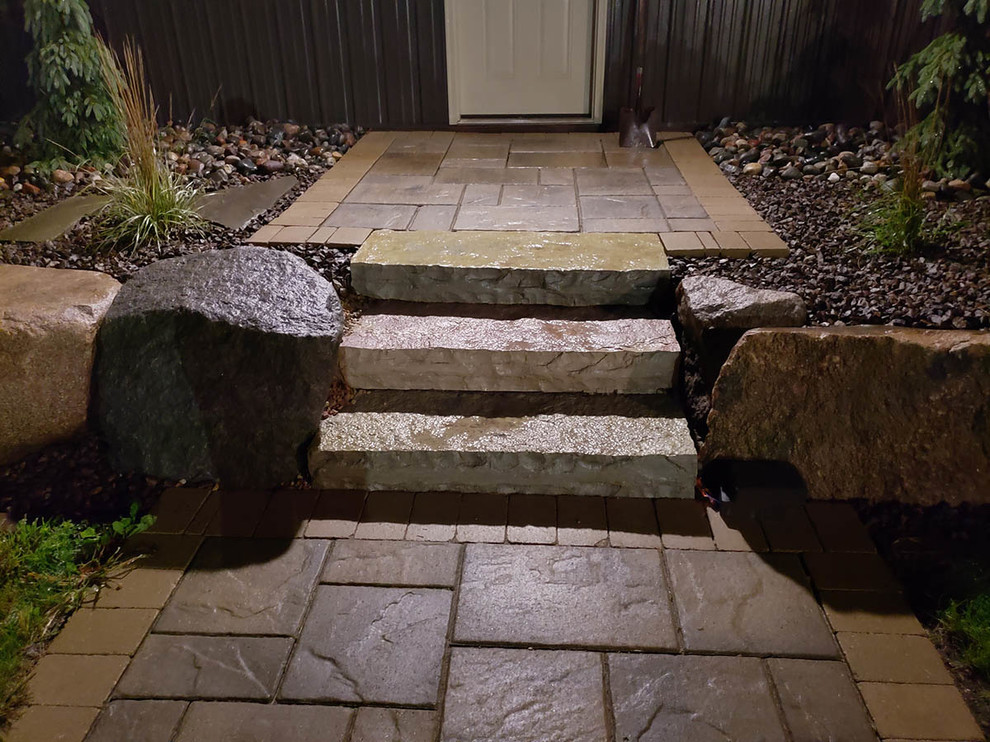 Driveway, Fire Pit, Patio & Boulder Wall Transitional Patio Minneapolis by NS Landscapes