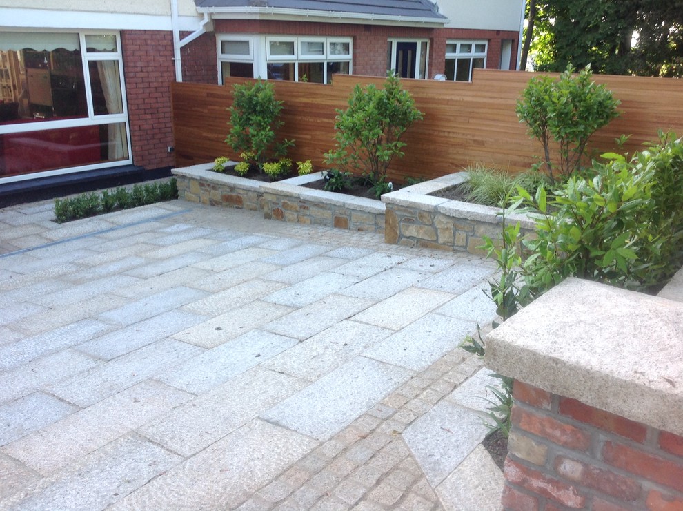 This is an example of a contemporary patio in Dublin.