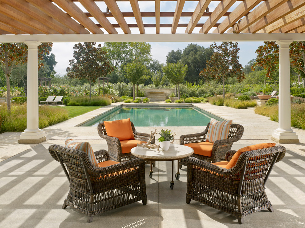 Farmhouse concrete patio photo in San Francisco with a pergola