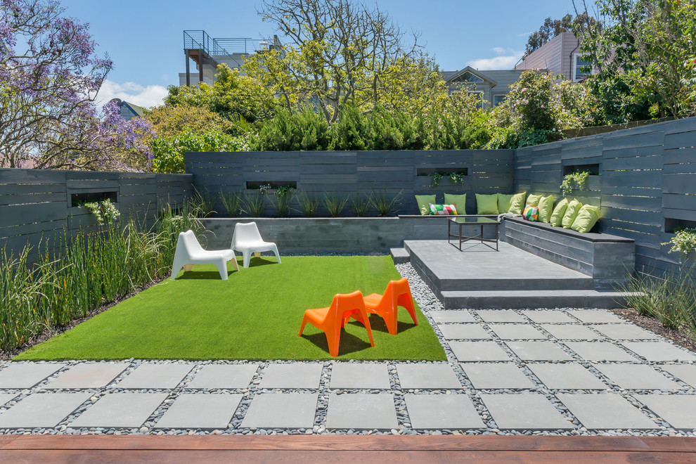 Trendy backyard concrete paver patio container garden photo in Houston with no cover