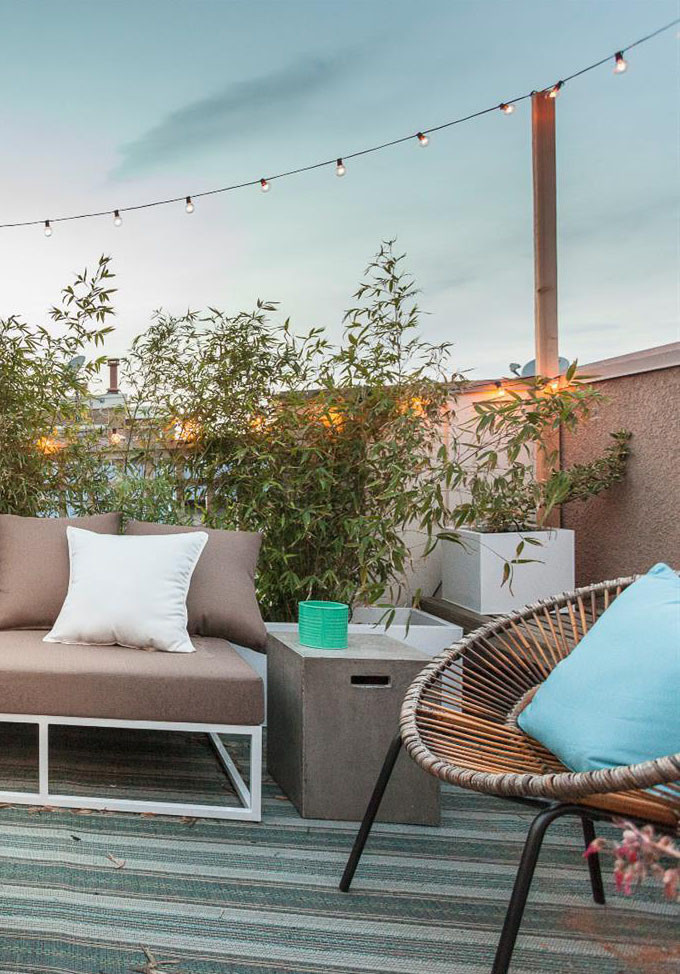 Design ideas for a small eclectic patio in Los Angeles with a fire feature, concrete slabs and no cover.
