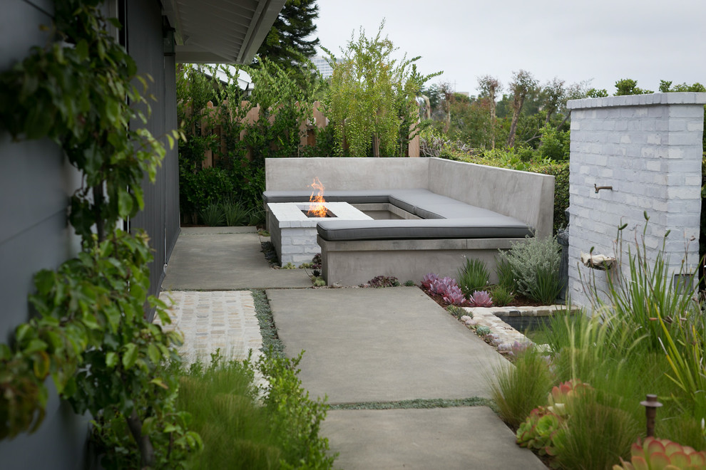 Inspiration for a transitional backyard patio remodel in Orange County