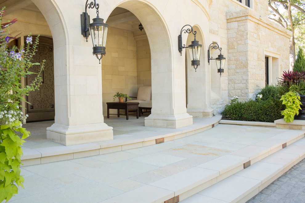 Design ideas for a traditional patio in Minneapolis with natural stone paving.