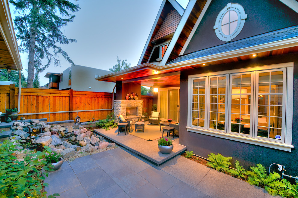 Patio - mid-sized traditional backyard patio idea in Calgary with a roof extension