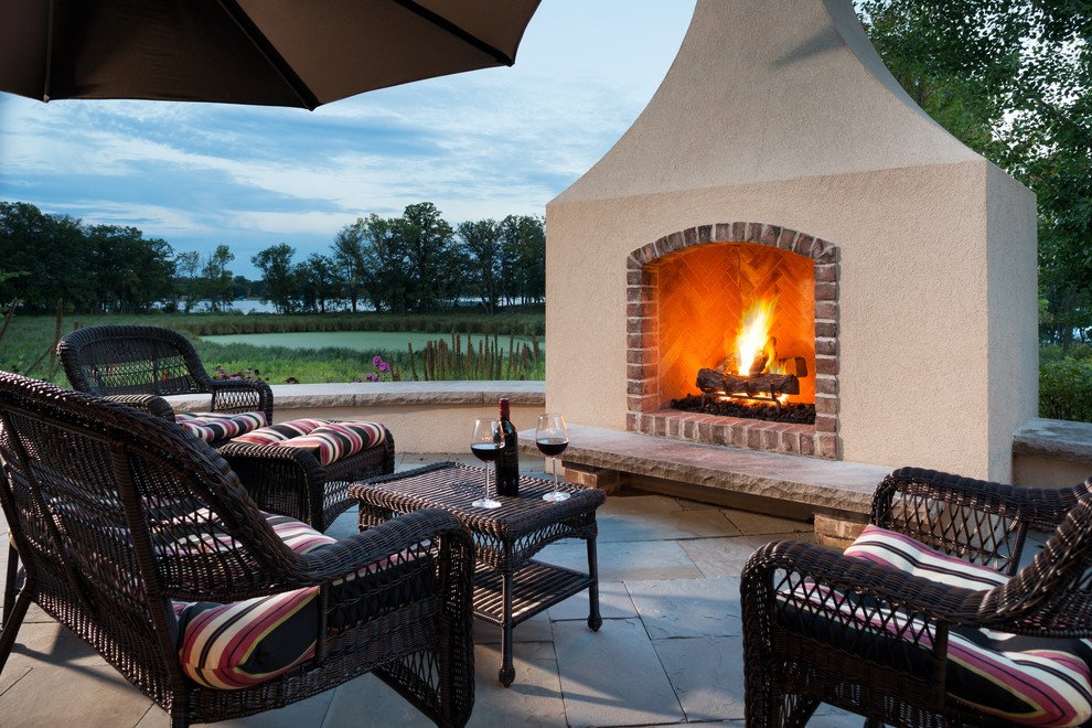 Inspiration for a timeless patio remodel in Minneapolis with a fire pit