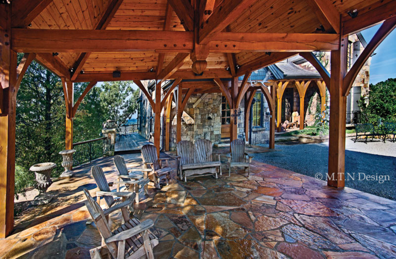 Immagine di un patio o portico rustico di medie dimensioni e dietro casa con pavimentazioni in pietra naturale e un gazebo o capanno