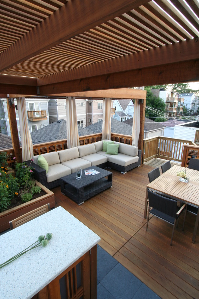 Medium sized contemporary patio in Chicago with decking and a gazebo.