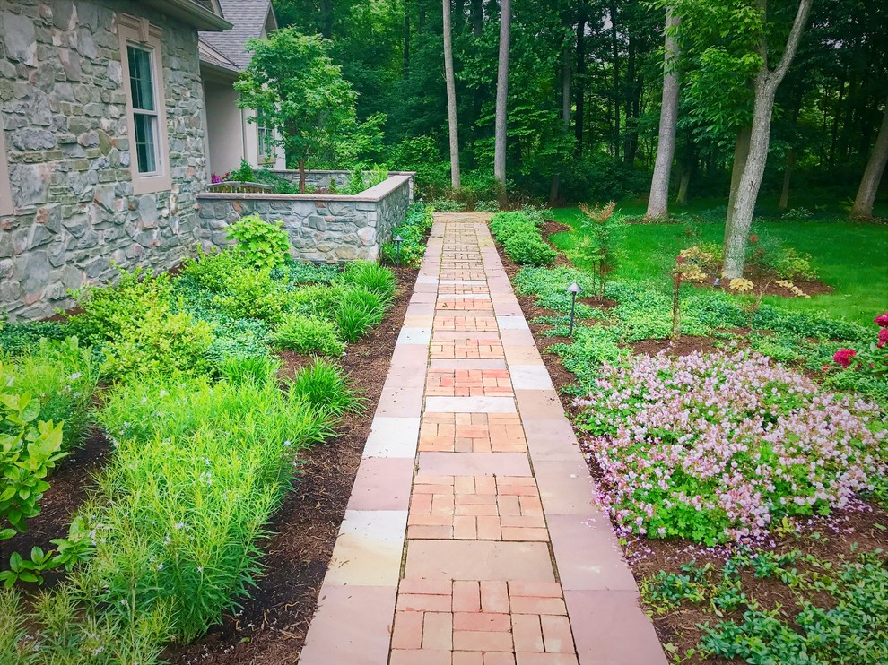 Design ideas for a small classic front garden in Other with natural stone paving.