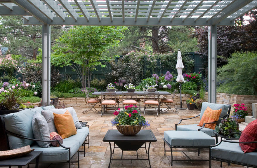 Patio - transitional backyard tile patio idea in Denver with a pergola