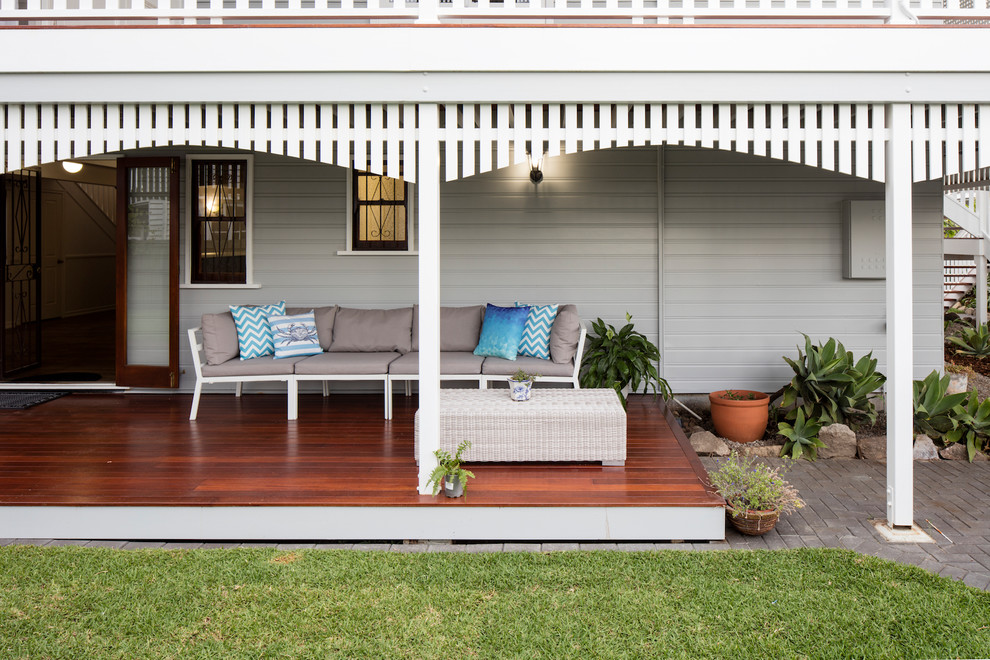 Inspiration for a modern front yard patio remodel in Brisbane with decking and a roof extension