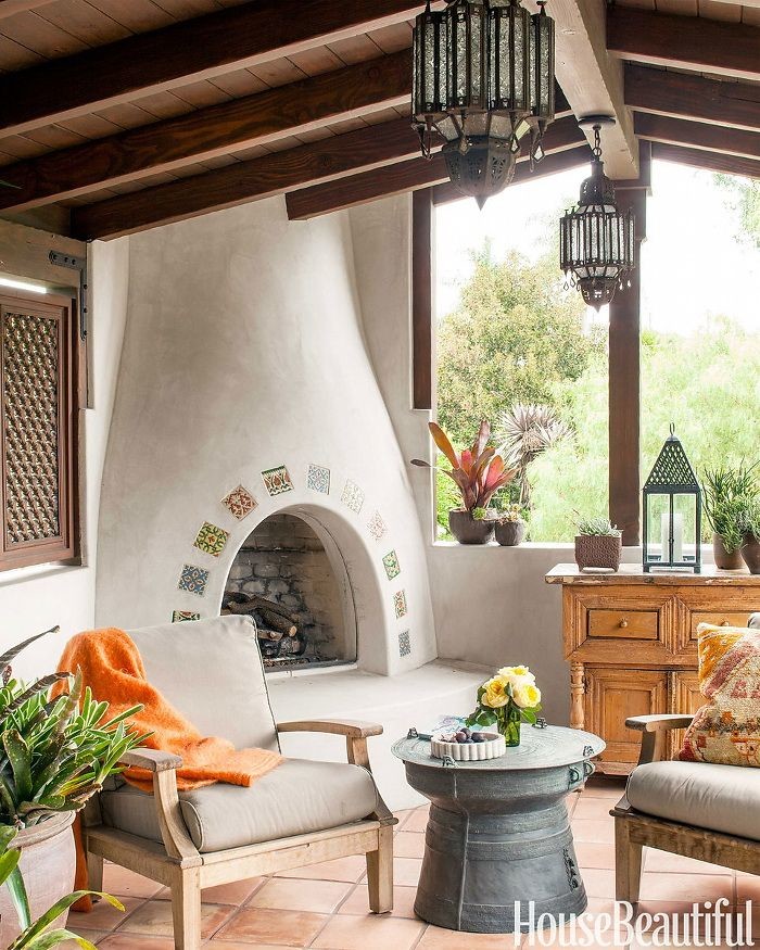 Example of a southwest patio design in Los Angeles with a roof extension