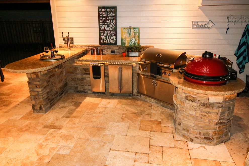 Inspiration for a classic back patio in Houston with natural stone paving.