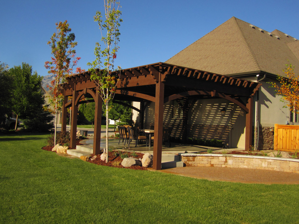 Design ideas for a rustic front patio in Salt Lake City with a pergola.