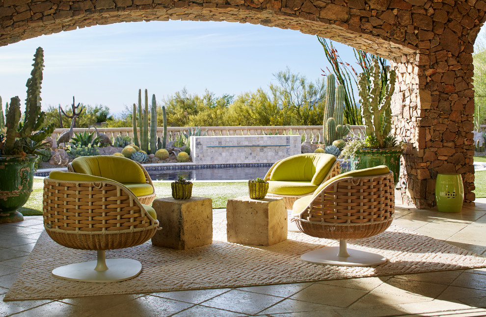 Inspiration for a southwestern backyard tile patio remodel in Phoenix with a roof extension