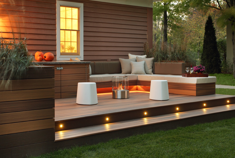 Inspiration for a transitional patio remodel in Other with a fire pit