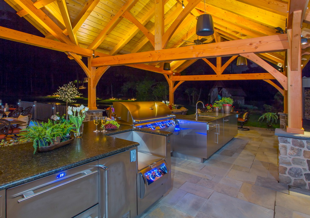 Large transitional backyard stone patio kitchen photo in Philadelphia with a roof extension