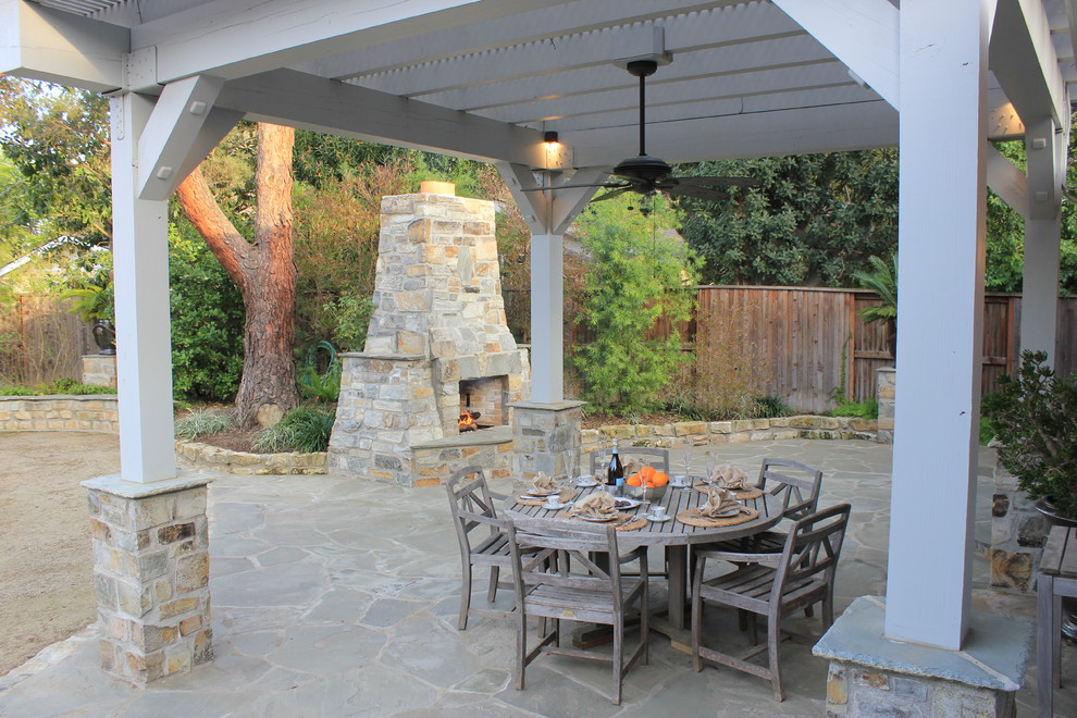 Photo of a mediterranean patio in Sacramento with a fire feature and a pergola.