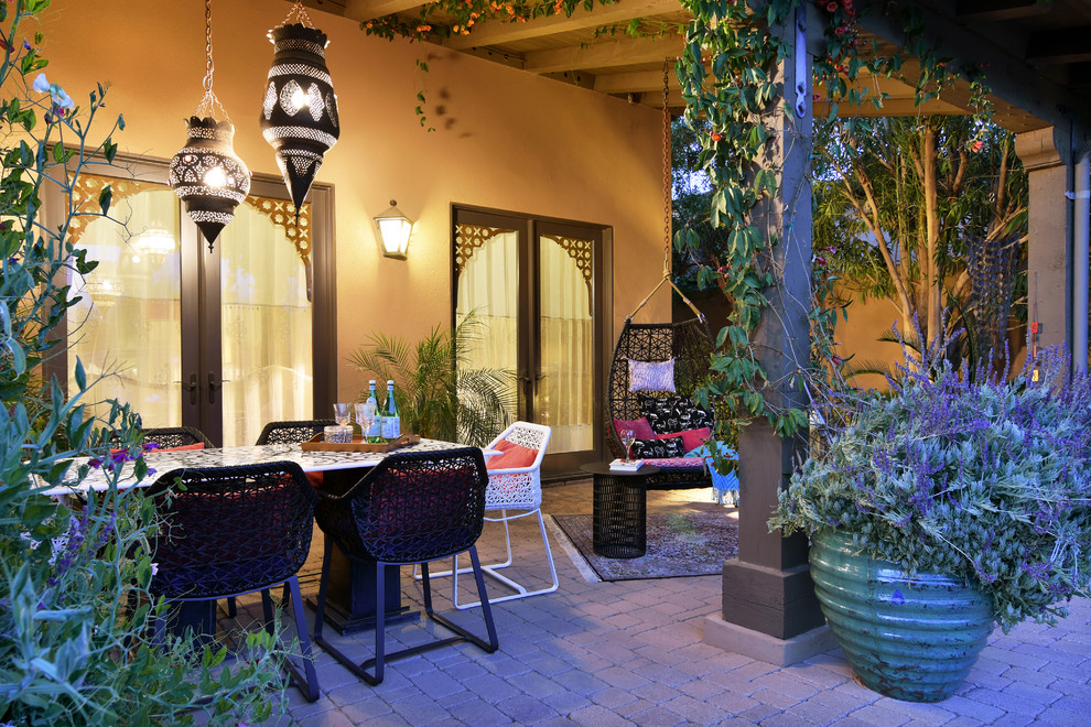 Mid-sized tuscan backyard stone patio vertical garden photo in Phoenix with a pergola