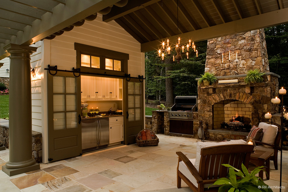 Design ideas for a medium sized country back patio in Baltimore with an outdoor kitchen, natural stone paving and a gazebo.