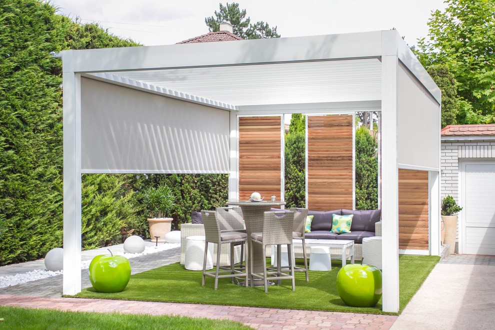 Design ideas for a contemporary patio in Other with a pergola.