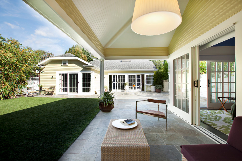 Inspiration for a classic patio in Los Angeles with a roof extension.