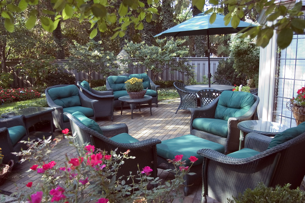 Patio - large traditional backyard patio idea in Columbus