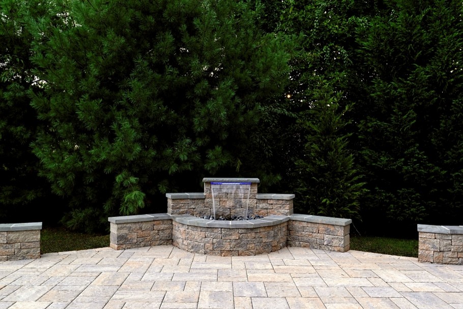 This is an example of a large traditional back patio in DC Metro with a water feature, concrete paving and no cover.