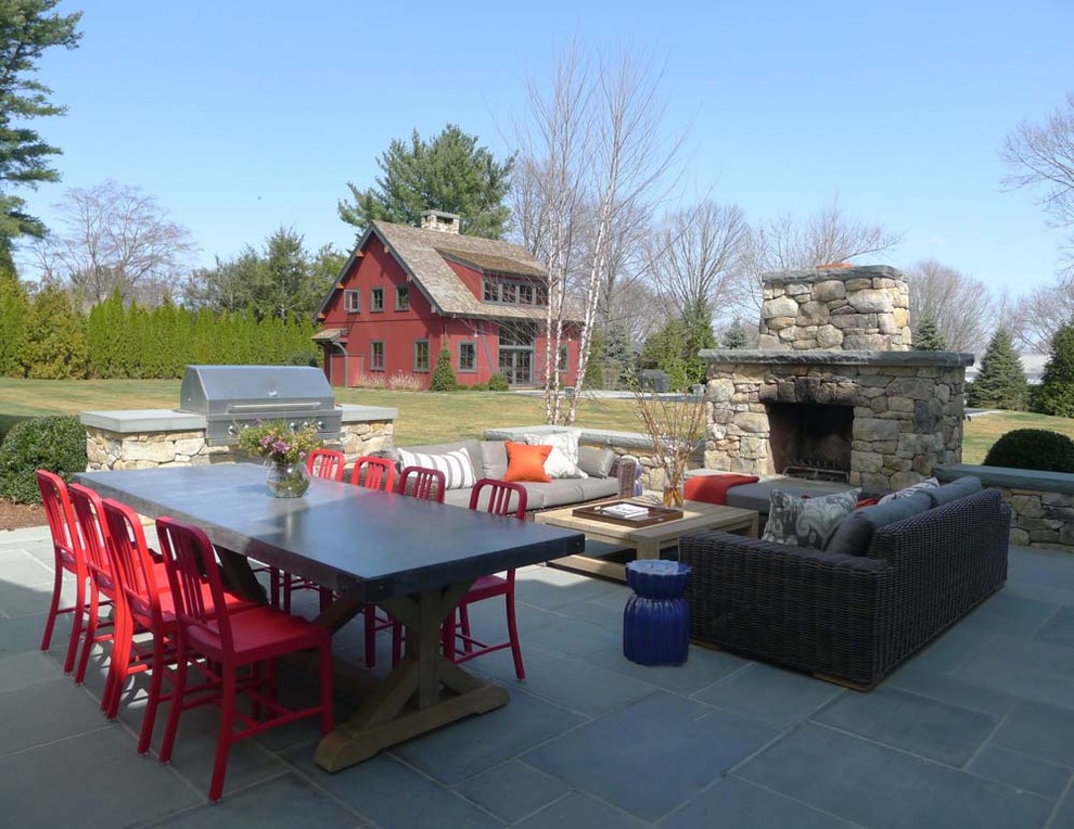 Example of a large trendy backyard tile patio design in New York with a fire pit and no cover