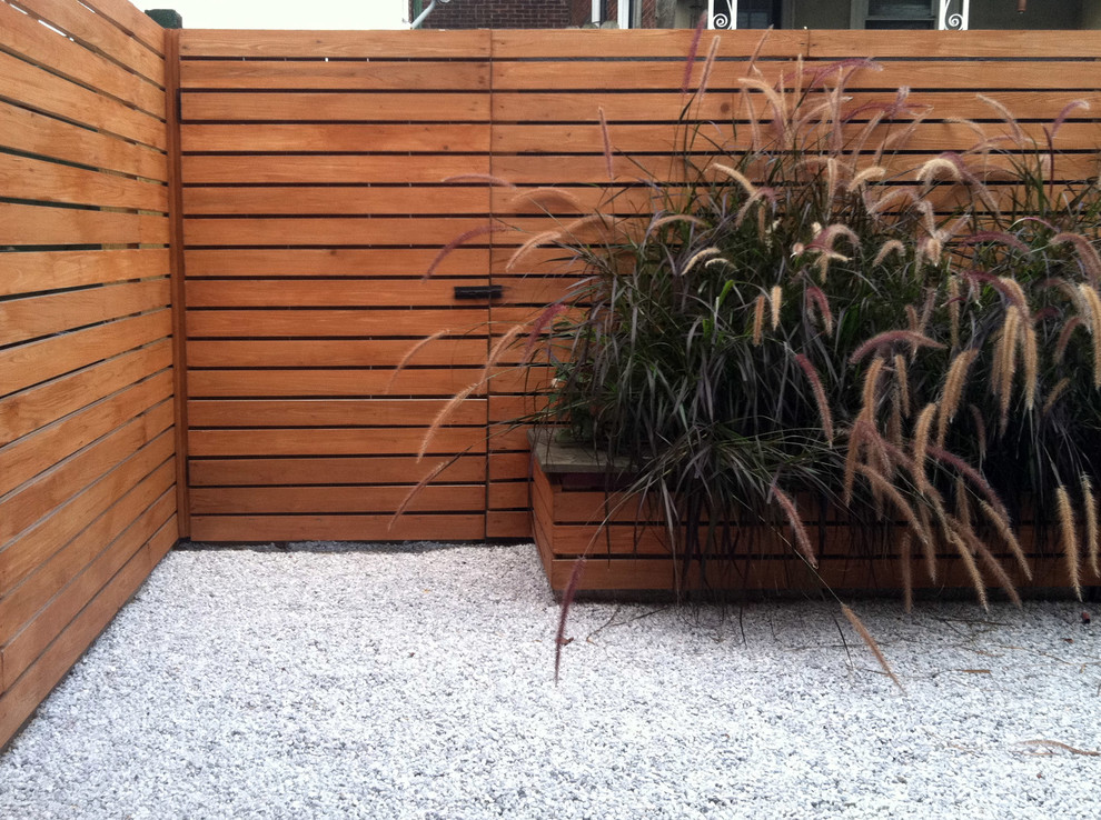 Example of a small eclectic backyard gravel patio design in Philadelphia with no cover