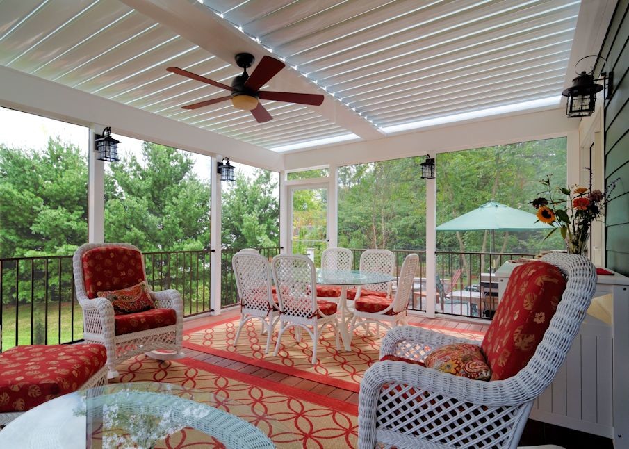 Example of a large classic backyard patio design in DC Metro with decking and a pergola