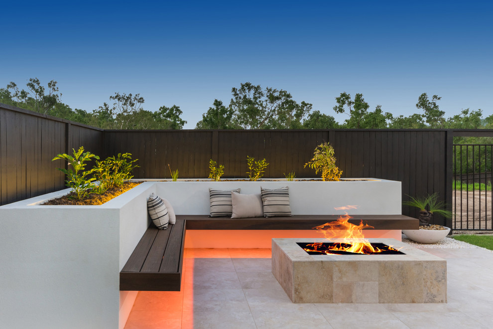 Design ideas for a large contemporary back patio in Townsville with a fire feature and concrete paving.