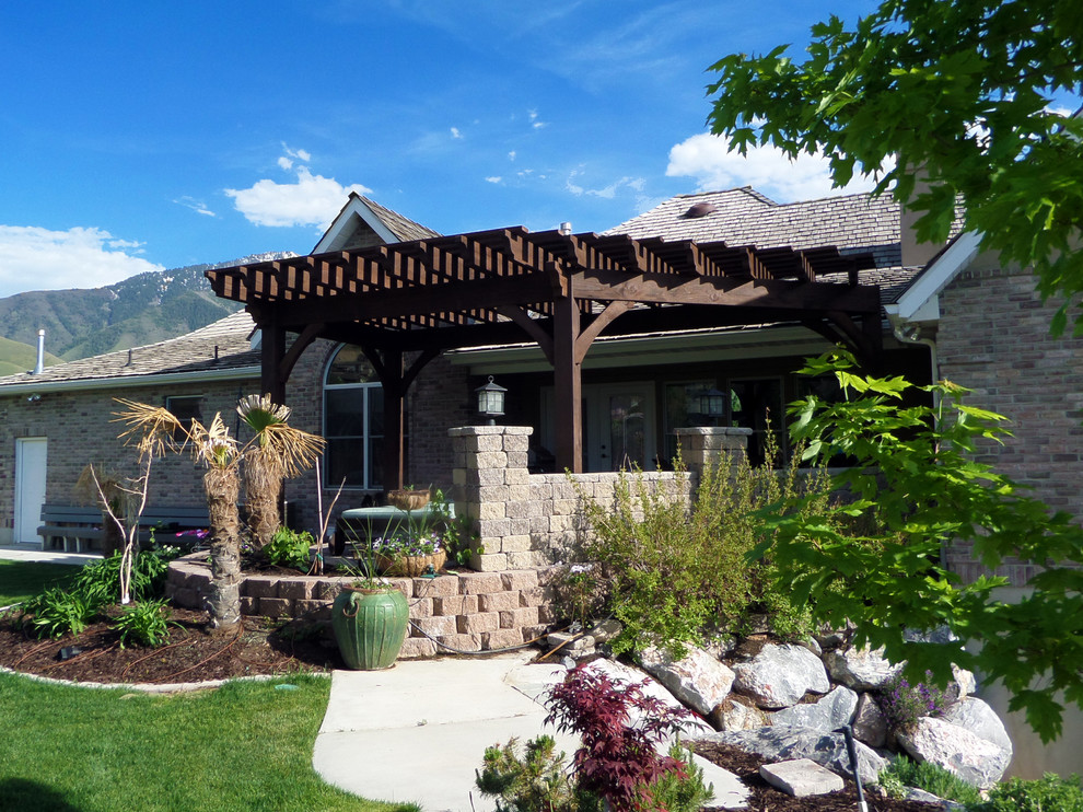 Inspiration for a traditional patio in Salt Lake City with a pergola.