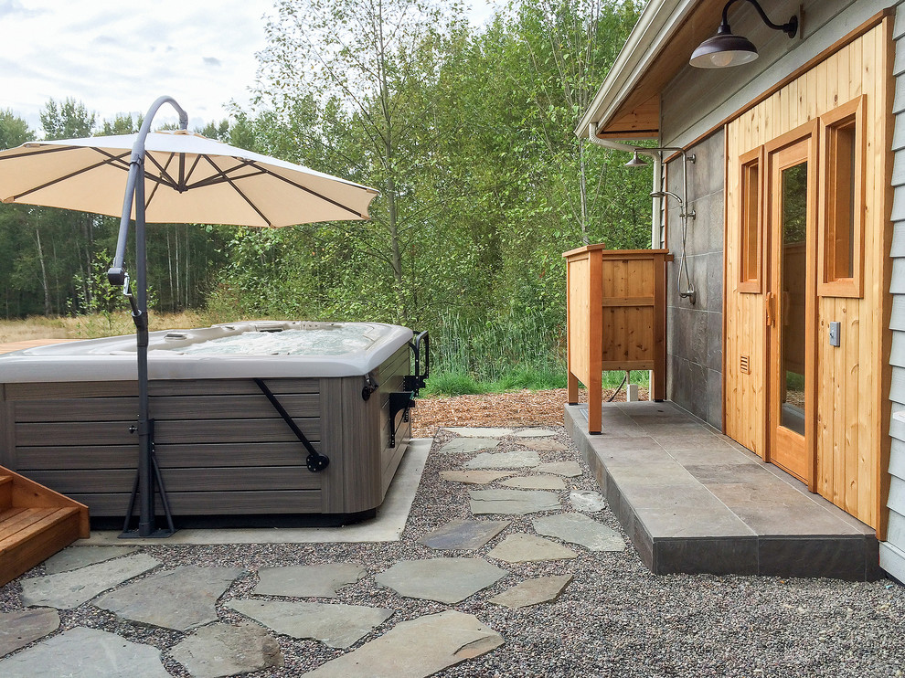 Design ideas for a medium sized contemporary back patio in Seattle with an outdoor shower, gravel and a roof extension.