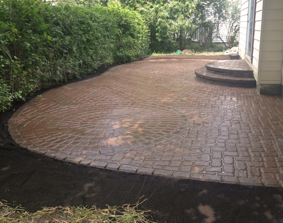 Photo of a medium sized victorian back patio in Ottawa with brick paving.