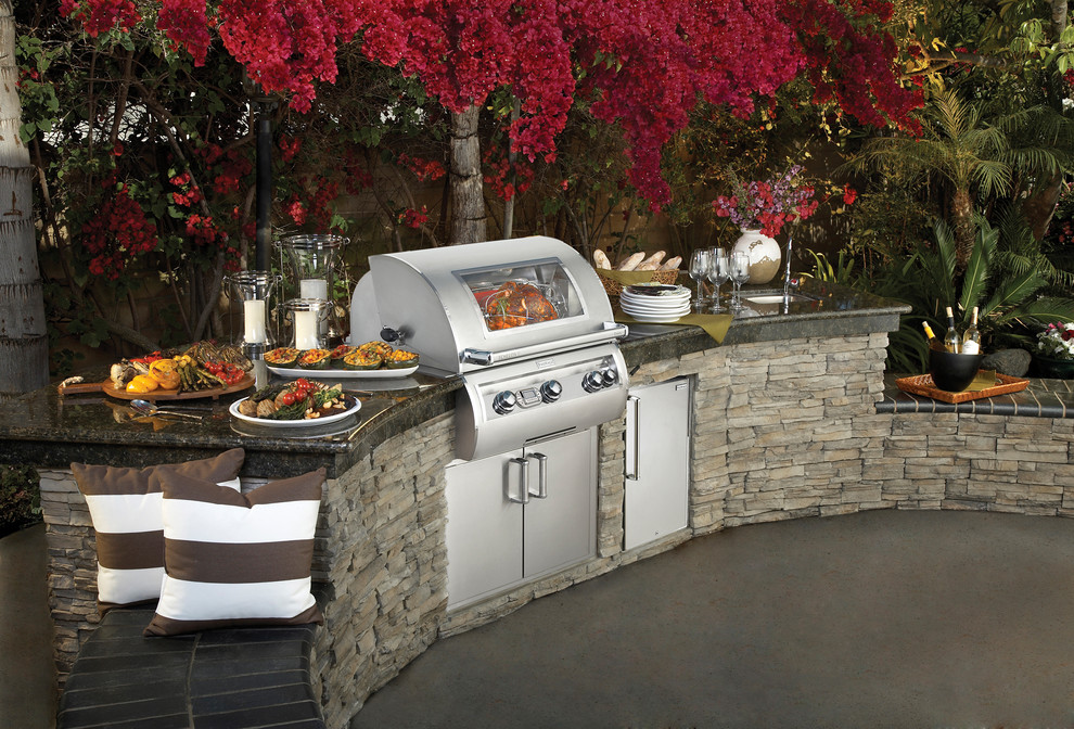 Patio kitchen - mid-sized transitional backyard concrete patio kitchen idea in Los Angeles with no cover