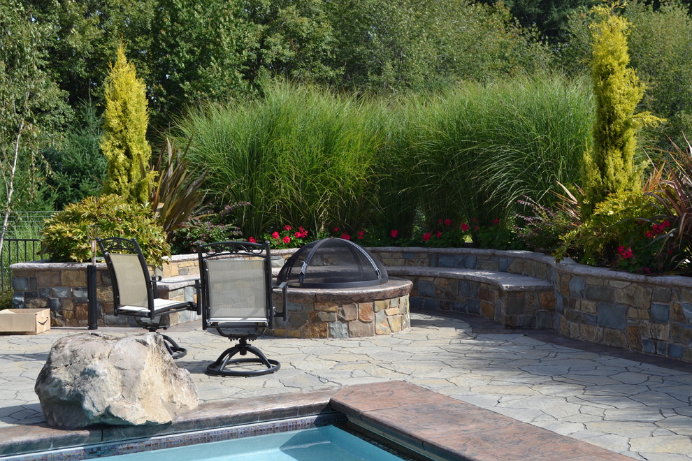 Example of a classic patio design in Portland with a fire pit