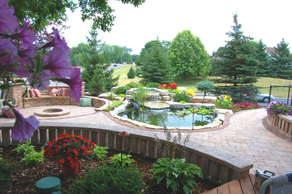 Fire pit & pond Traditional Patio Minneapolis by Daryl Melquist