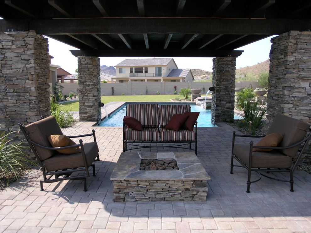 Patio - mid-sized backyard brick patio idea in Phoenix with a gazebo