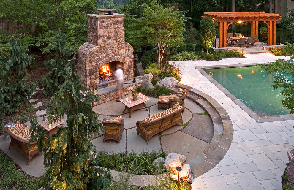 Inspiration for a large timeless backyard stone patio remodel in DC Metro with a fire pit and no cover