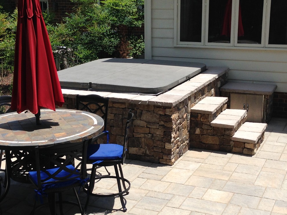Patio - large traditional backyard stamped concrete patio idea in Richmond with a fire pit and no cover