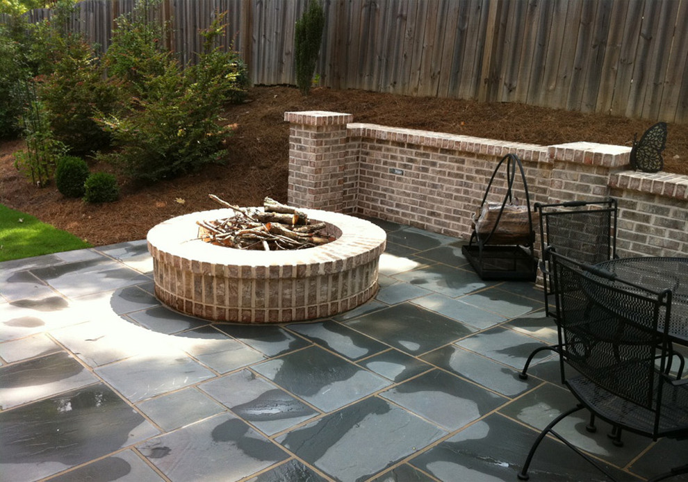 Inspiration for a medium sized contemporary back patio in Atlanta with a fire feature, natural stone paving and no cover.