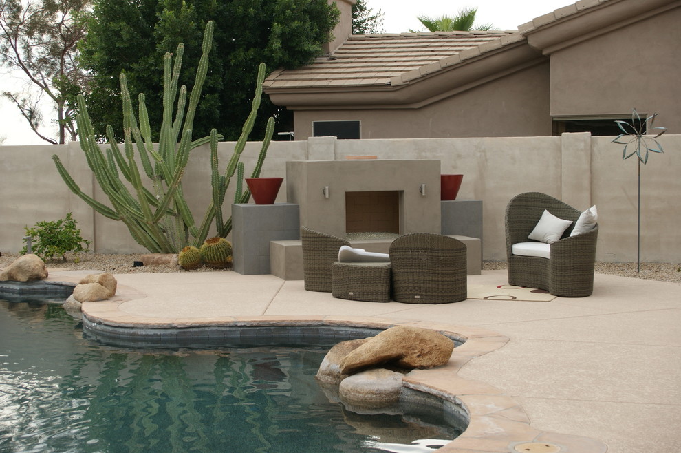 Mediterranean patio in Phoenix with a fire feature.