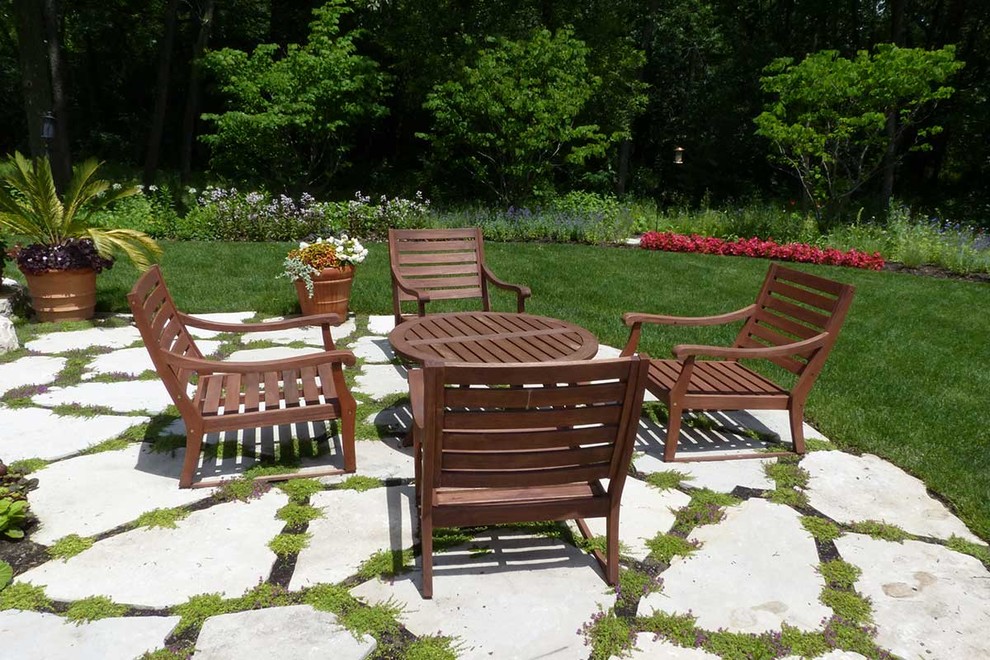 Flagstone and creeping thyme soften the patio Traditional Patio