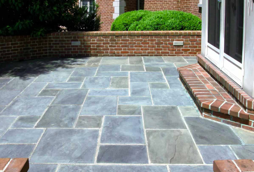 Inspiration for a timeless backyard stone patio remodel in Philadelphia with no cover