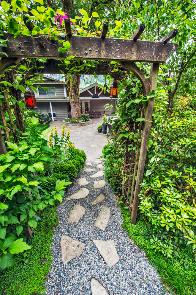 Flagstone path transitions from patio to gardens Rustic Patio