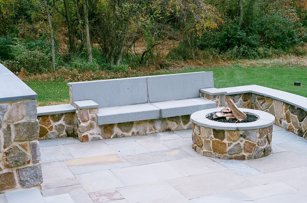 Patio kitchen - huge traditional backyard stone patio kitchen idea in Philadelphia with no cover