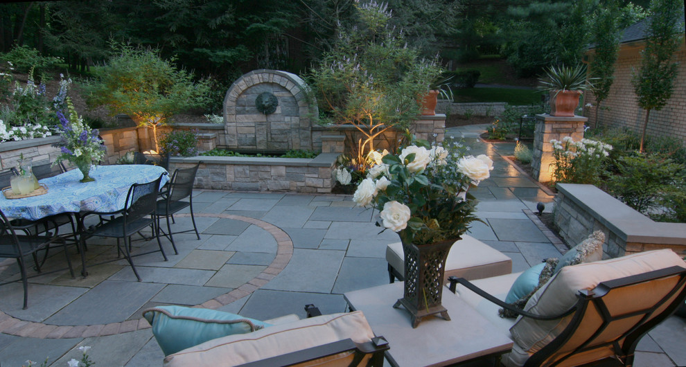 Flagstone Patio with Fountain and Brick Detail Traditional Patio